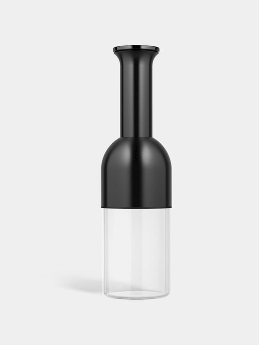 A wine decanter with a graphite satin finish on the upper part and a clear glass base. It has a sleek, modern design.